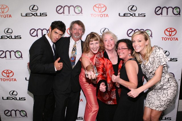 A group of people posing for a picture at an event.