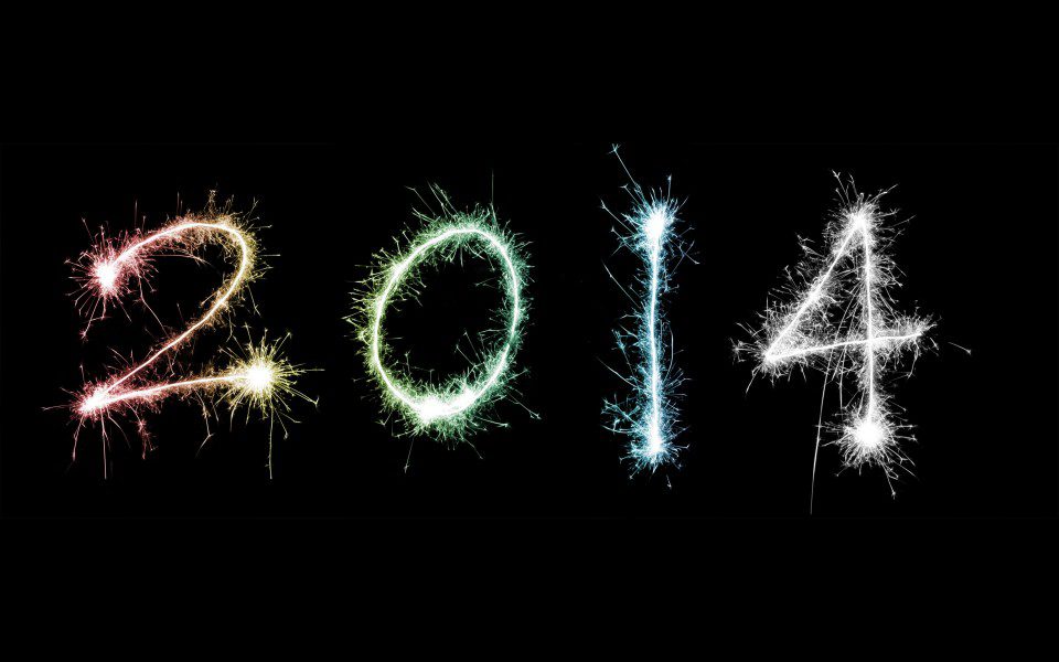 The number 2014 is written with sparklers on a black background.