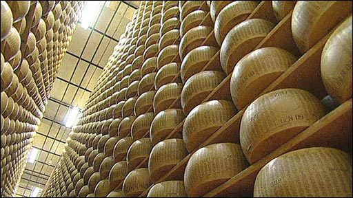 A room full of cheese in a warehouse.