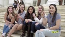 Five girls sitting on the stairs and smiling