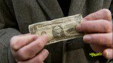 Man showing a money note