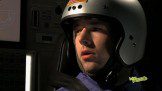 An astronaut with a seatbelt and a helmet