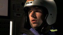 A closeup shot of a man wearing a helmet