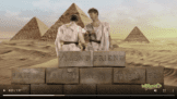 A man and a woman in between pyramids and bricks
