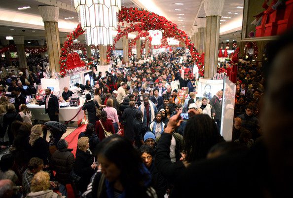 A crowd of people in a shopping mall.