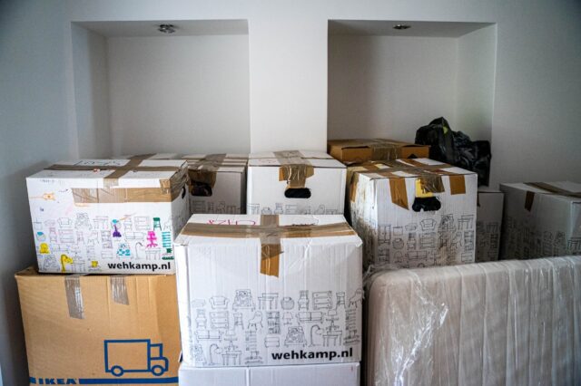 A room filled with boxes and a truck.