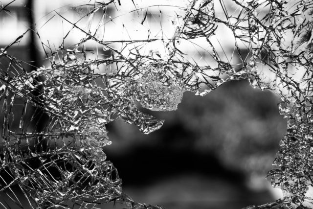 Black and white image of a broken glass