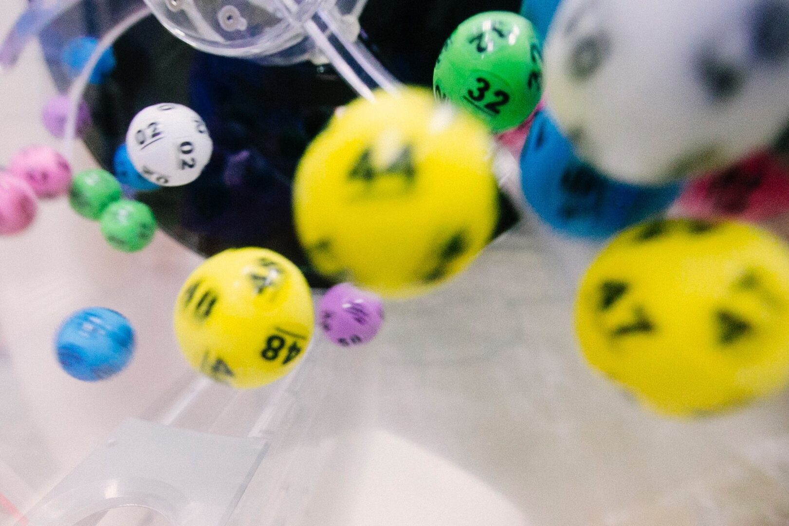 Lottery balls in a plastic container.