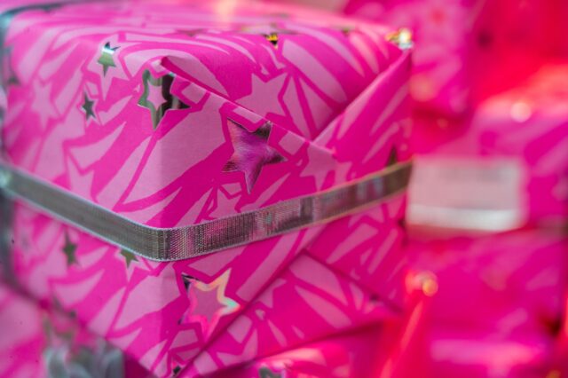 Closeup of a pink gift box with stars on it